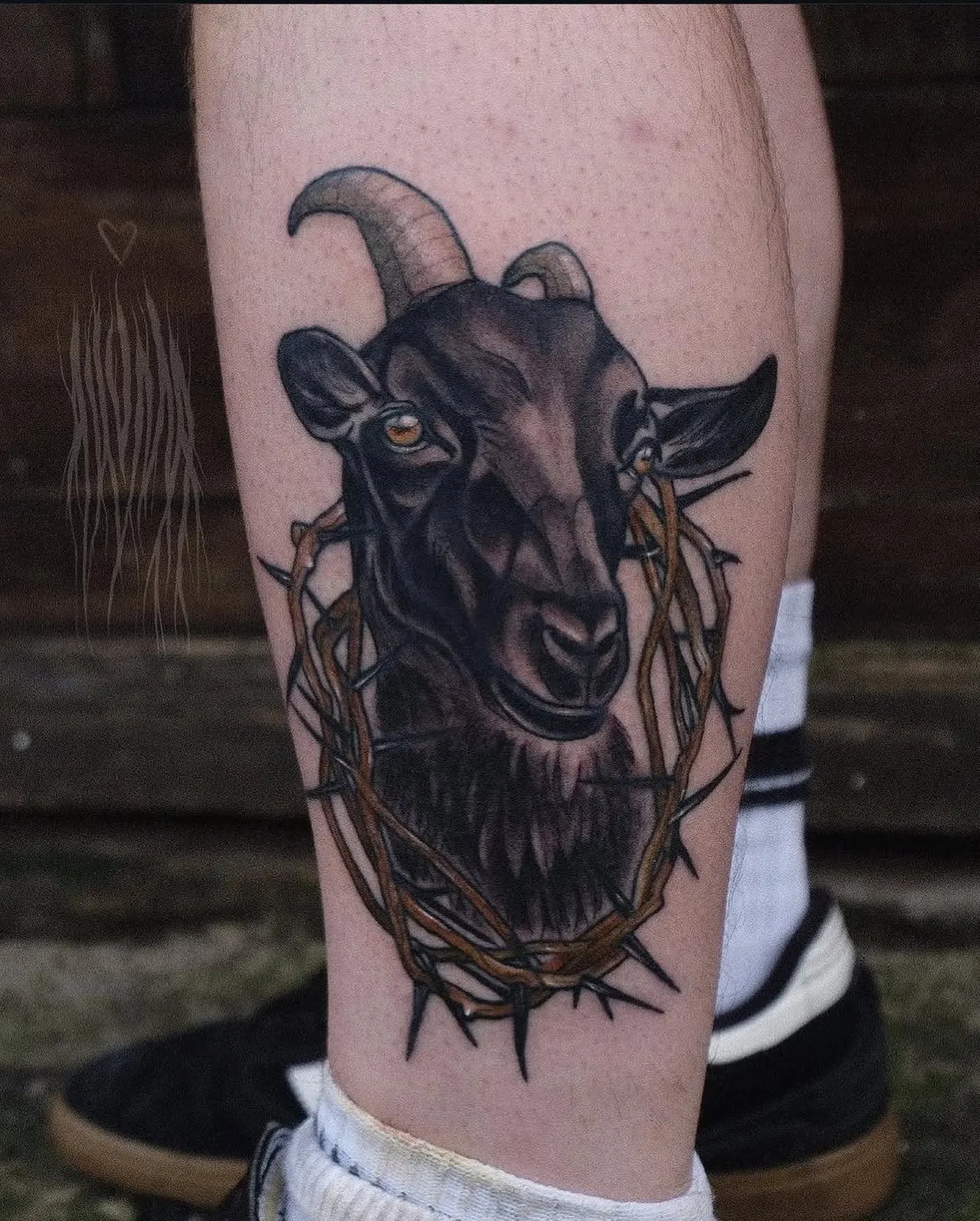 Neo-traditional goat with crown of thorns tattoo on a calf Wolf & Dagger Tattoo Hove