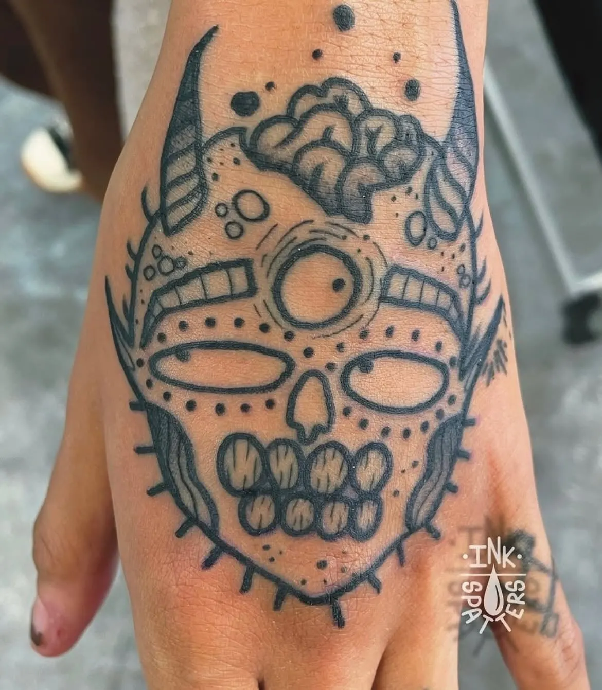 Ornamental blackwork hand tattoo Wolf & Dagger Tattoo Hove