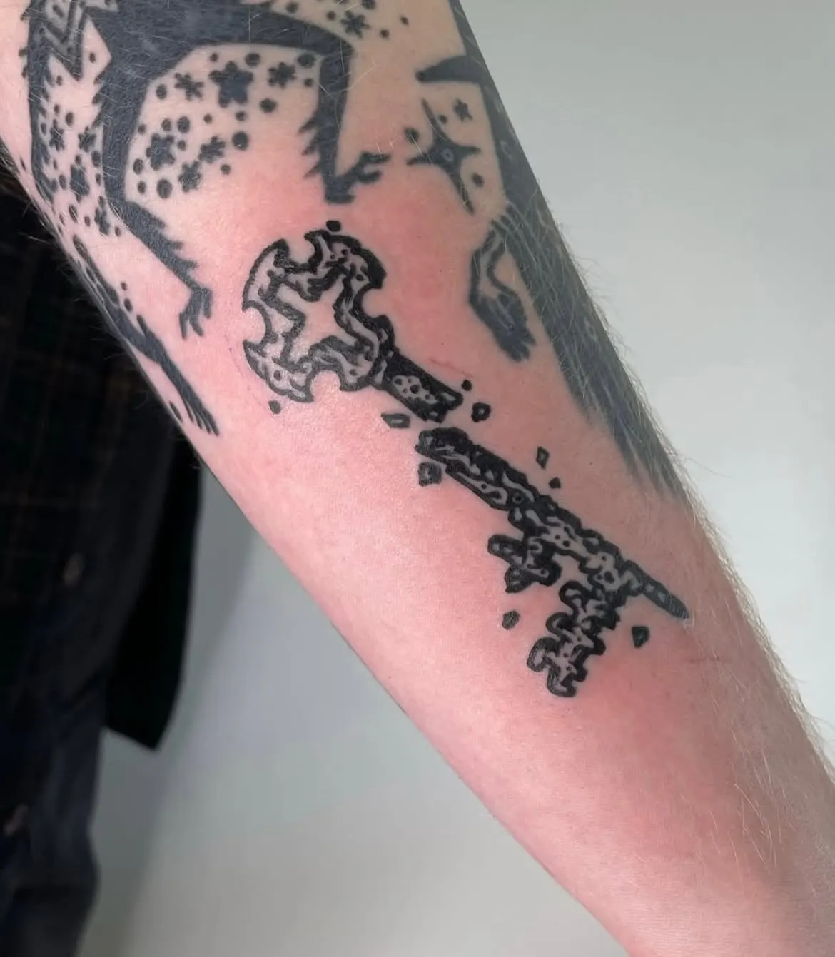 Ornate black key tattoo on a forearm Wolf & Dagger Tattoo Hove