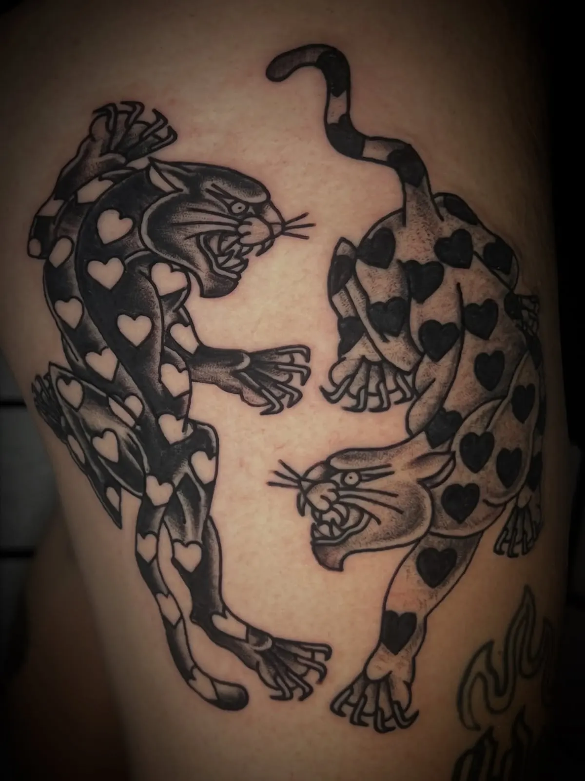 Pair of traditional panther tattoos on a thigh Wolf & Dagger Tattoo Hove