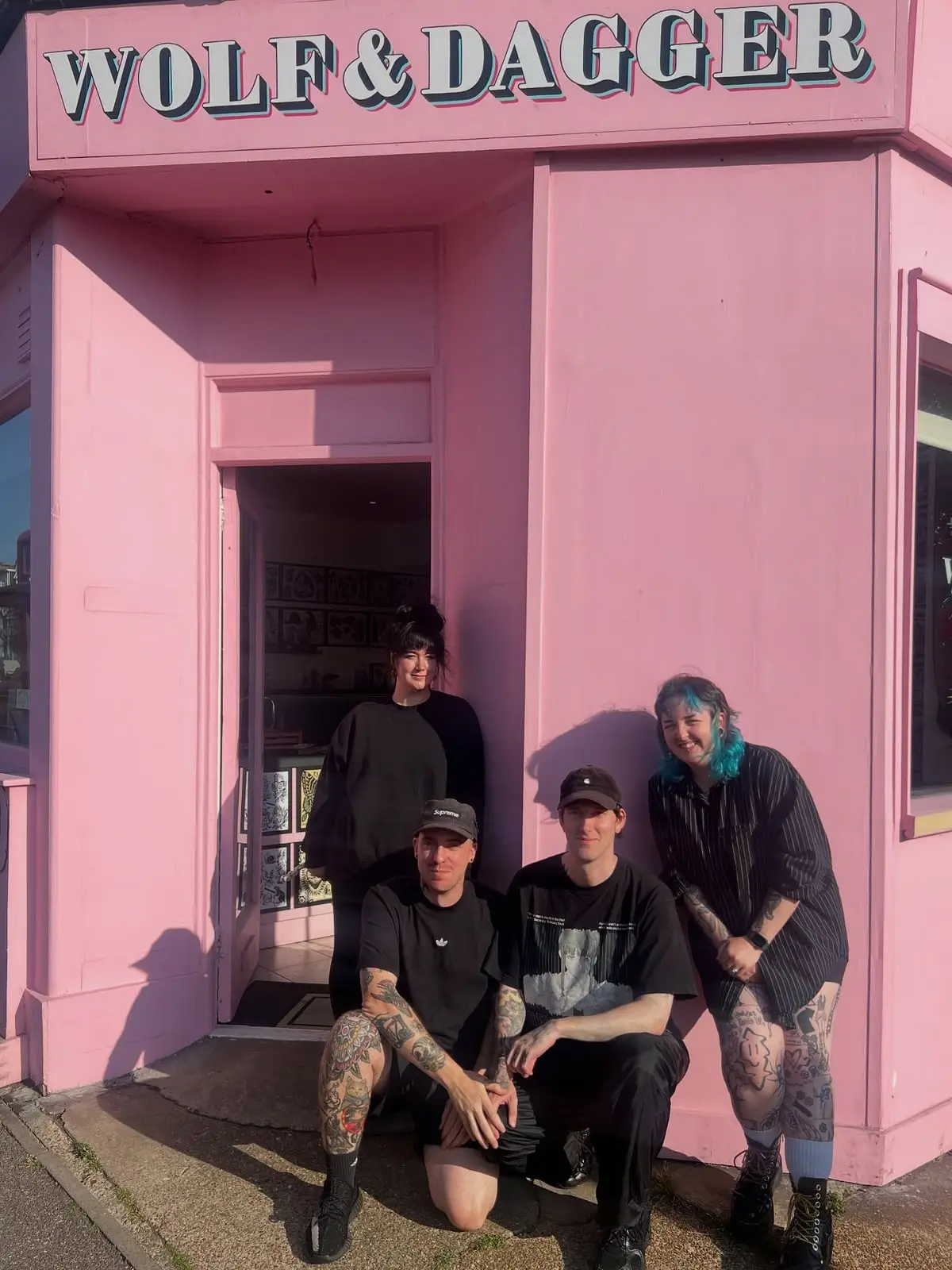 Wolf & Dagger tattoo artists outside the pink studio in Hove