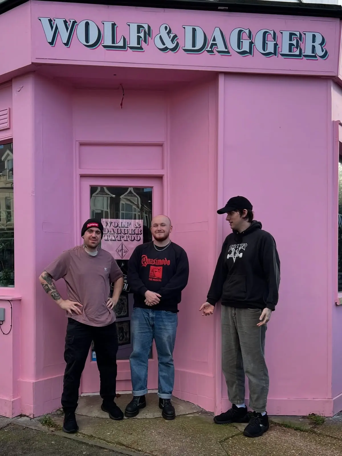 Pink shopfront of Wolf & Dagger Tattoo at 102 Portland Road Hove