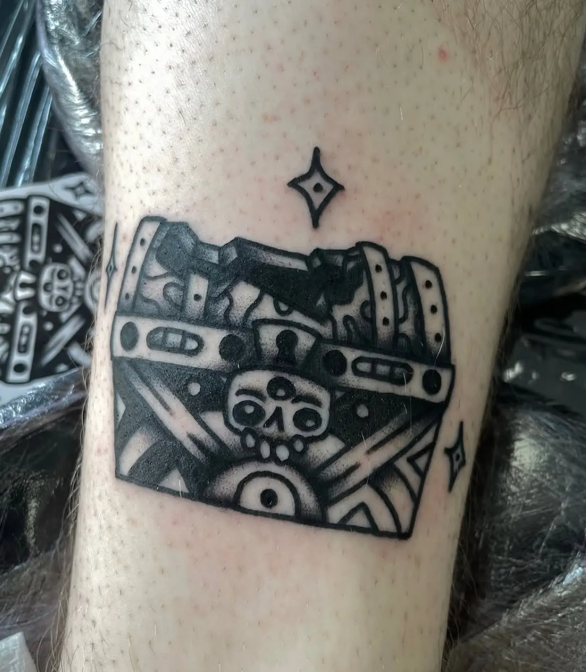 Blackwork treasure chest tattoo on a forearm Wolf & Dagger Tattoo Hove